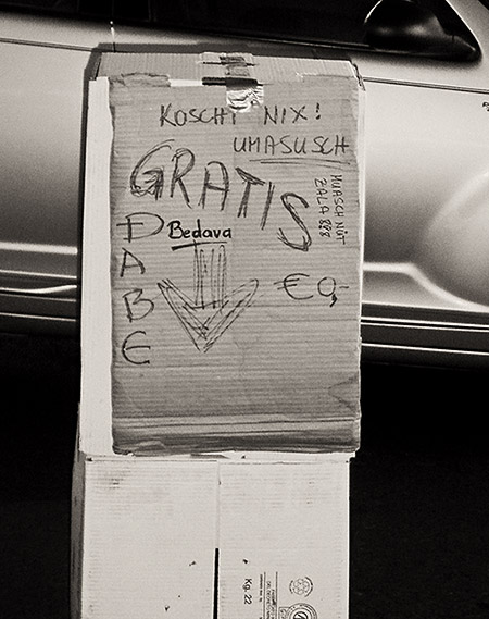 At a flea market in Hohenems, Austria, in August 2007. All of the terms on the sign have the same meaning: FOR FREE!